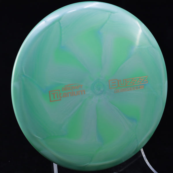 Discraft - Buzzz - Titanium - Midrange GREEN GOLD 173-174 adam buz buzz Buzzz Disc Golf disc golf discs disc golf discs for sale Discraft discs esp esp buzzz hammes mid Mid-Range mid-range-midrange midrange Paul Mcbeth titanium