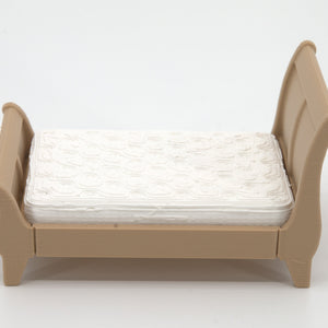 1:24 dollhouse sleigh bed in Natural Oak with tufted mattress, side view, real photo